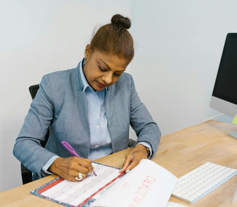 Calendar with several days marked, symbolizing a consistent routine.